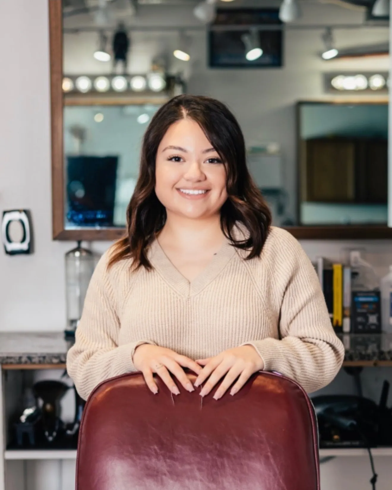 Melanie M., barber at Unlisted Barbering Co.